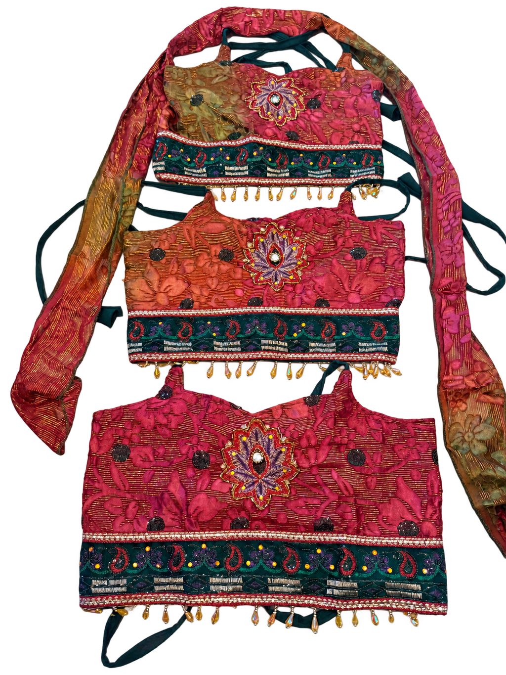 Cosmic Jungle — user-approved background-cleaned photograph of three actual tops, pattern placement varies