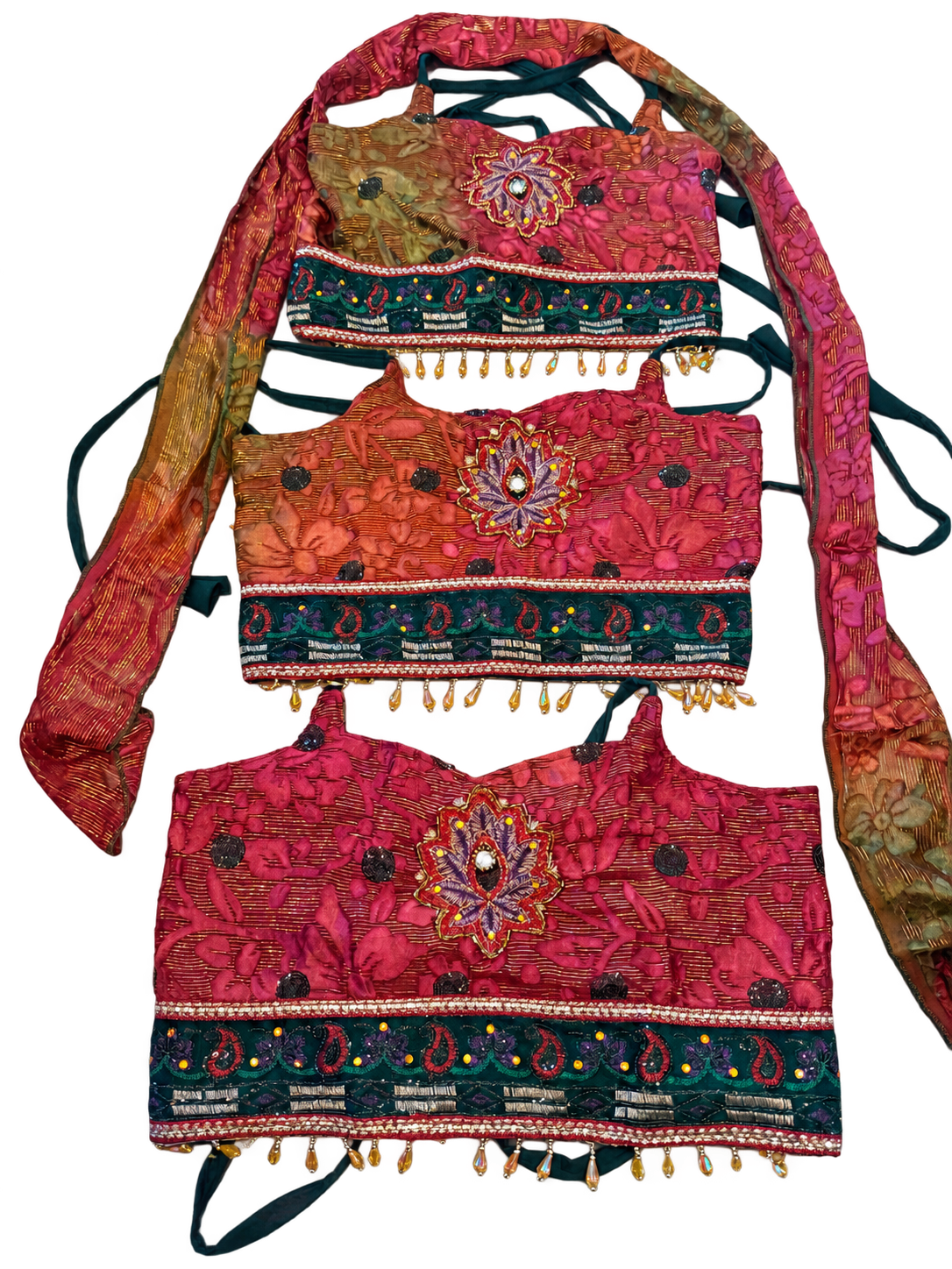 Cosmic Jungle — user-approved background-cleaned photograph of three actual tops, pattern placement varies